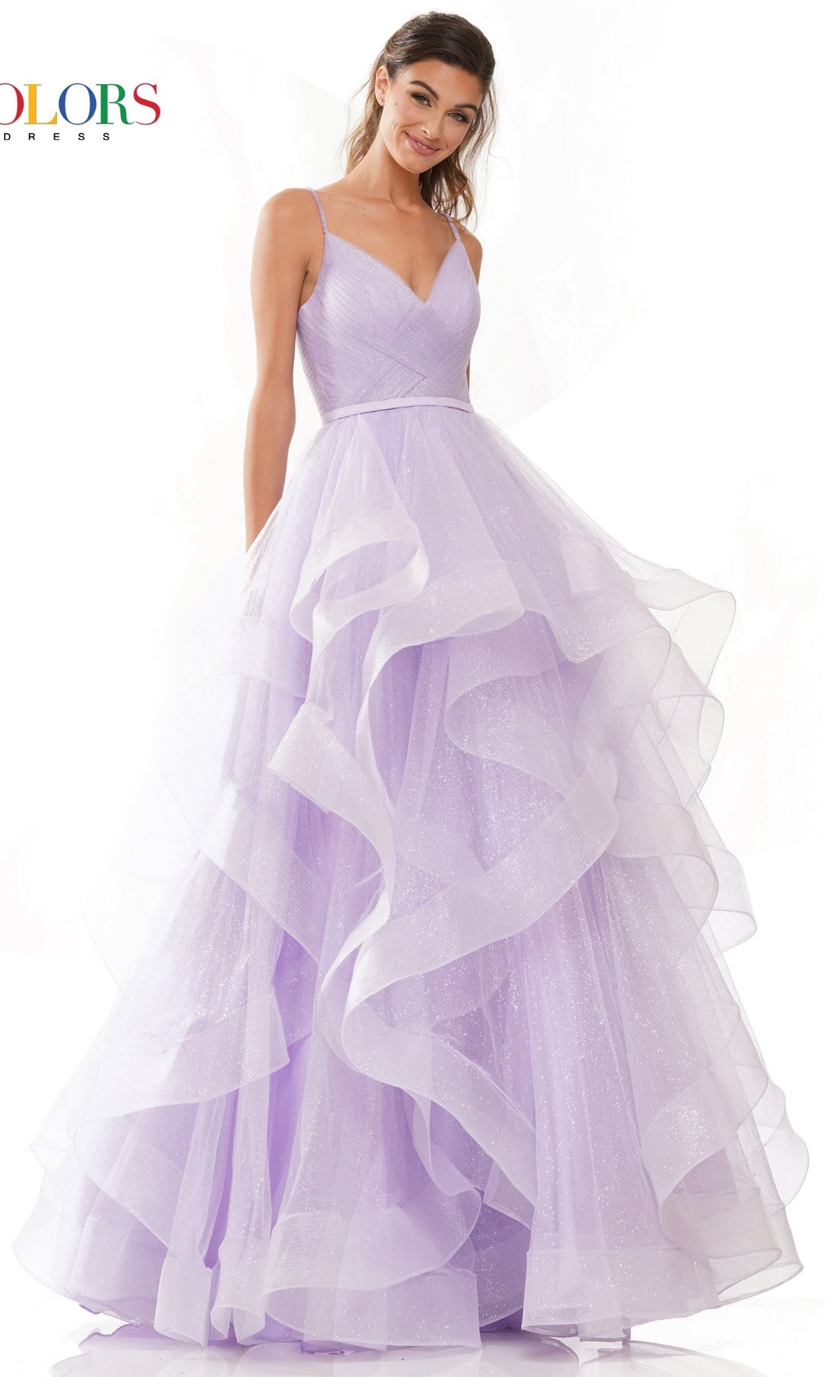 A woman in the Layered Long Tulle Prom Ball Gown 2381, featuring lavender tiered ruffled tulle and spaghetti straps, stands against a white background.